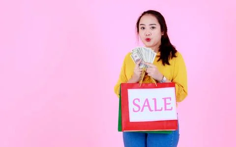 Portrait studio shot of Asian young rich wealthy female shopaholic shopper .. Foto stock