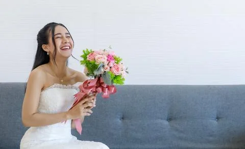 Portrait studio shot of Asian young happy cheerful beautiful female bride i.. Foto stock