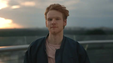Portrait of stylish guy spending evening outdoors Stock Footage 162831115