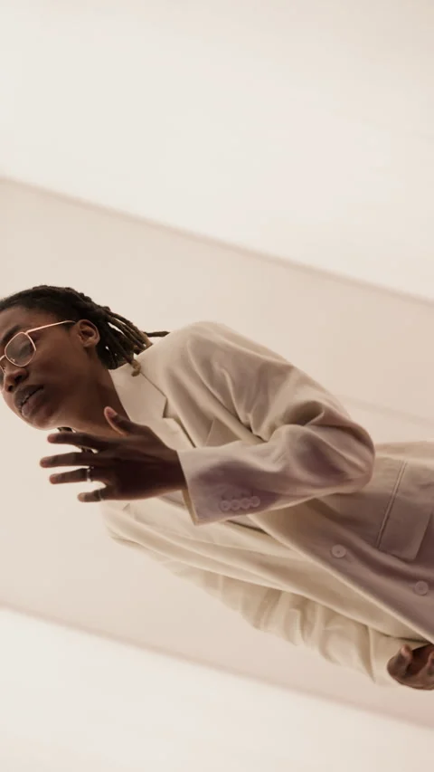 Portrait of Stylish Young Black Man with Dreadlocks Dancing and Posing in Studio Stock Footage 337407746