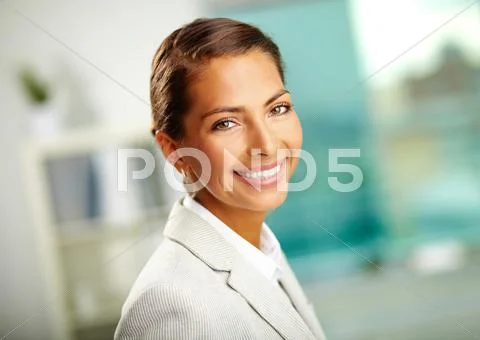 Portrait of successful female looking at camera with smile Stock Photos