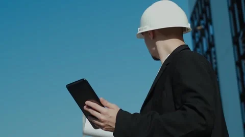 Portrait of a successful handsome engineer, architect, builder, businessman in a Stock-Footage 249263057