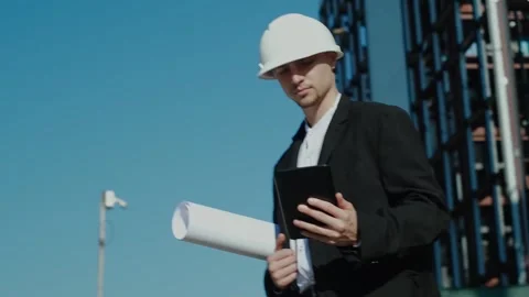 Portrait of a successful handsome engineer, architect, builder, businessman in a Stock Footage 249263059