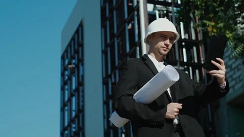 Portrait of a successful handsome engineer, architect, builder, businessman in a Stock Footage 249263067