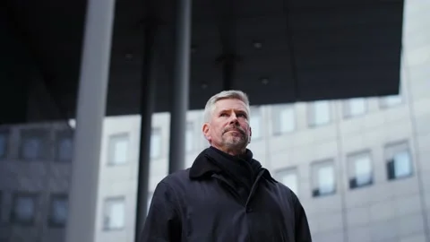 Portrait of successful middle aged man in front of office buildings downtown. Stock Footage 165204302