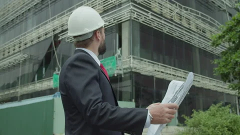 Portrait of a successful young handsome engineer, architect, builder Stock Footage 229196972