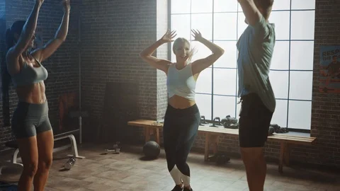 Portrait of Super Happy Team of Two Girls and one Boy Jumping, Dancing Vidéo 114243524