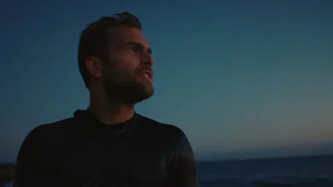 A portrait of surfer watching sunset Stock Footage 136427577