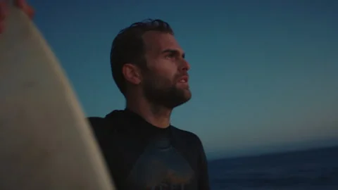 A portrait of surfer watching sunset Stock Footage 136427858