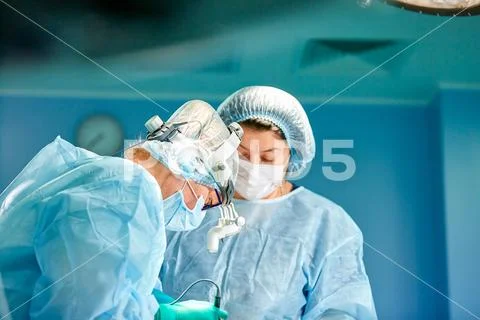 Portrait of a surgeon close-up. Surgeons operate on a patient. Tense, serious Stock Photos