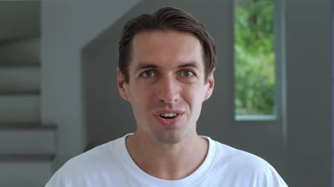 Portrait of surprised man looking at the camera and showing WOW emotion Stock Footage 239698669