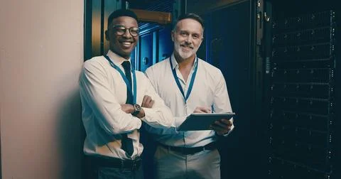 Portrait, tablet and men in server room, programming and teamwork with Stock Photos