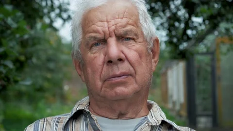 elderly grayhaired man pensioner examining counter with electronic