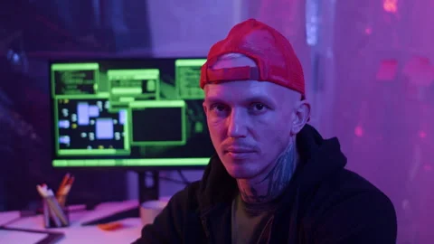 Portrait of Tattooed Male Hacker in Coding Room with Neon Light Video stock 303561266