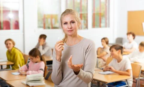 Portrait of teacher in classroom Stock Photos