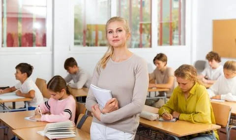 Portrait of teacher in classroom Stock Photos