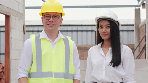 Portrait of team engineer looking to camera with smile at construction site. Stock Footage 134257044