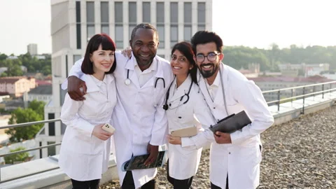 Portrait of team of multinational doctors in white coats with stethoscopes Stock Footage 262484077