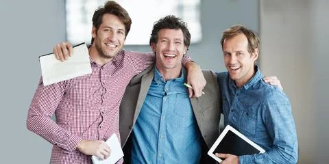Portrait, teamwork or happy developers hug for motivation for support Foto stock