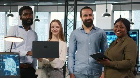 Portrait of teamworking programmers in office developing apps using AI Stock-Fotos