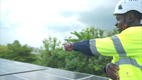 Portrait of technician inspects solar panel installation and test Stock Footage 282754875