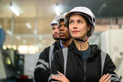 Portrait of technicians engineers team working at industrial factory Stock Photos