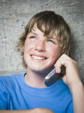 Portrait of a teenage boy using a mobile phone Stock Photos