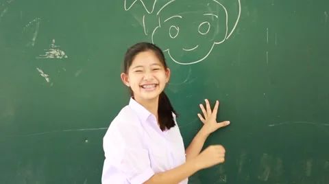 Portrait of thai student High School beautiful girl relax and playing in school Stock Footage 63153386