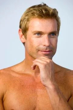 Portrait of thinking bare-chested man Stock Photos