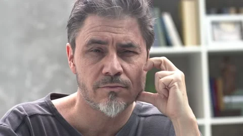 Portrait of thinking man at home, Видео 149201931