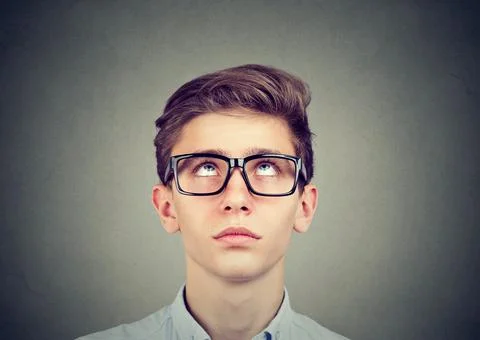 Portrait of a thinking man looking up Stock Photos