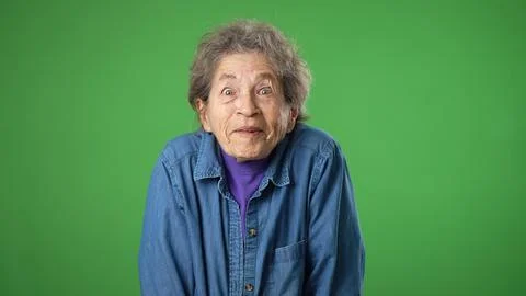 Portrait of thinking, smart puzzled pensive elderly senior old woman with Stock Photos
