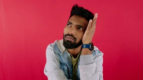Portrait of a thoughtful man thinking with a beard wearing a denim jacket h.. Stock Footage 262234090