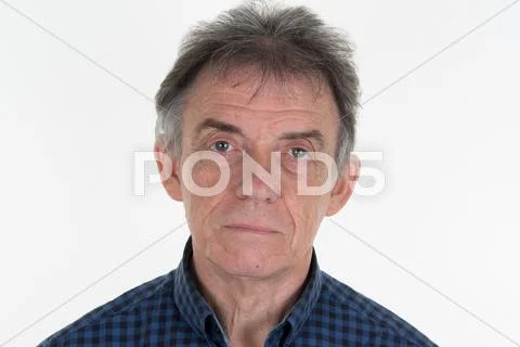 Portrait of a thoughtful senior man on white background Stock Photos