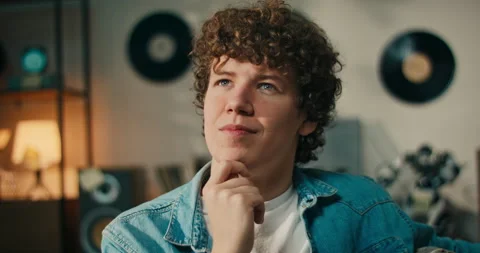 Portrait of a thoughtful young man while studying for an exam. Smiling student Stock Footage 218233380