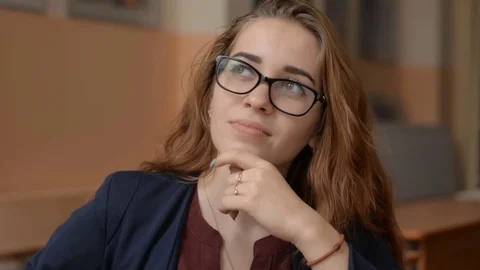 Portrait of a thoughtful young red-haired woman Stock Footage 80341926
