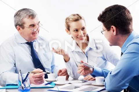 Portrait of three businesspersons brainstorming during coffee break Stock Photos
