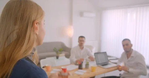 Portrait of three collleagues working together in the office indoors Video stock 113738384