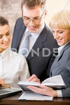 Portrait of three confident white collar office planning their work Stock Photos