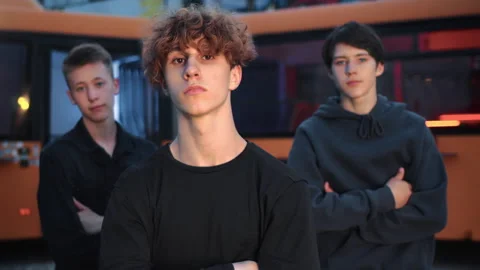 Portrait of three cool guys moving by music rhythm outdoors in street, b-boys Video stock 278662993