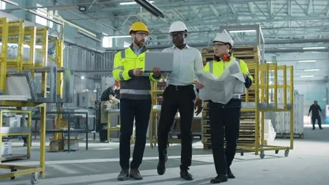 Portrait of three engineers workers in hard hats talking. Bearded Caucasian male Stock Footage 239540209