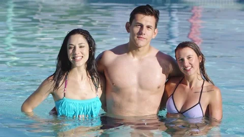 Portrait of three friends in the pool Stock Footage 80134140