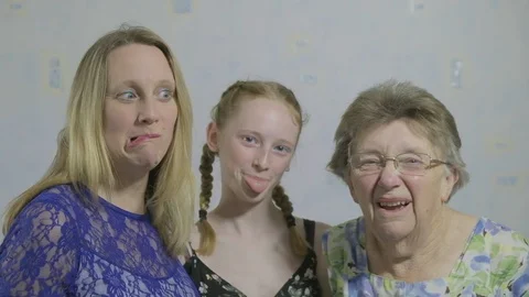 Portrait of three generations pulling funny faces Video stock 90103778