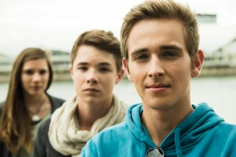 Portrait of three serious teenagers outdoors Stock Photos
