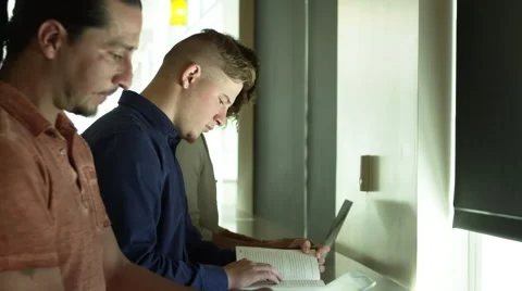 Portrait of three students reading Video stock 67364708