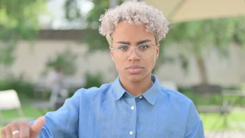 Portrait of Thumbs Down Gesture by Young African Woman Stock Footage 156664684