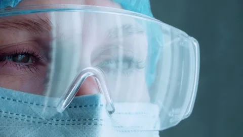 Portrait of a tired doctor-nurse in a protective mask and glasses. Stock Footage 302913402