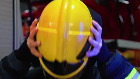 Portrait of tired fireman at fire station Vídeo Stock 256815830