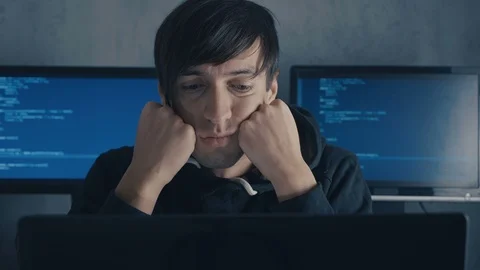 Portrait of Tired Hacker Programmer is overworking on computer in data center Stock Footage 101262159