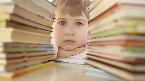  Portrait of a tired student of a junior school with textbooks  Stock Footage 73327299